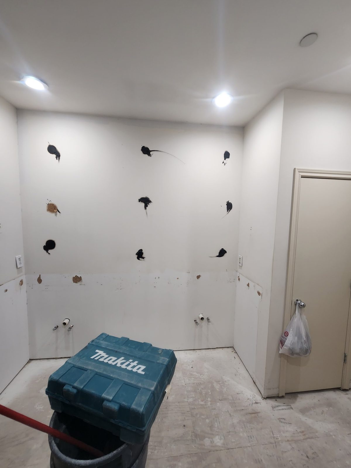 Wall repair patches ready for paint during a bathroom remodel